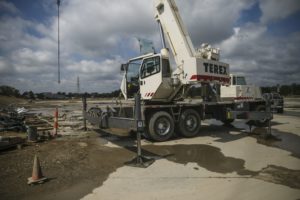 A Terex Corp. crane sits on the construction site of the American Mobility Center (ACM) in Ypsilanti, Michigan, U.S., on Tuesday, Aug. 15, 2017. Representative Debbie Dingel, a Democrat from Michigan, and Representative Bob Latta, a Republican from Ohio, visited the ACM to meet with experts in the autonomous vehicles industry as the two work together to advance bipartisan self-driving vehicle legislation through the House floor.