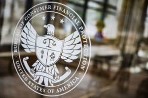 A seal at the Consumer Financial Protection Bureau (CFPB) headquarters in Washington, D.C., U.S., on Saturday, April 16, 2022. The Credit-reporting company TransUnion is an "out-of-control" repeat offender engaging in deceptive marketing practices the CFPB alleged this week after filing a lawsuit.
